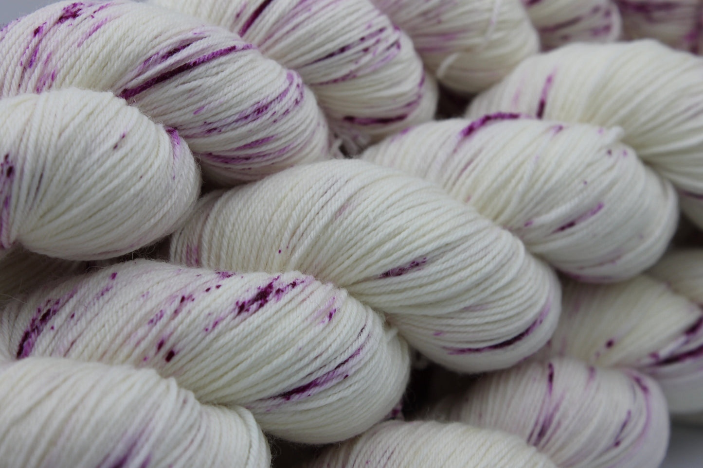Wild Raspberry Light Speckle Sock Skein 75% SuperWash Merino and 25 Nylon Hand Dyed Yarn 100g